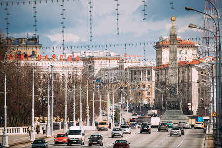 Minsk, Belarus. Traffic At Independence Avenue On Background Mon
