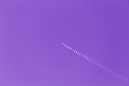 Contrail In Blue Sky. Plane, Clear Sunny Sky Ultra Violet Purpleの写真素材