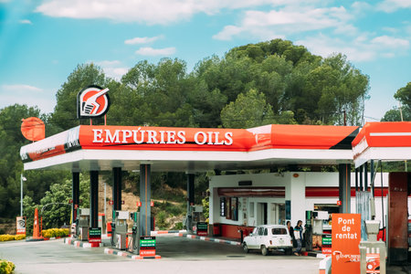 People Refuel Car With Fuel At The Empuries Oils Gas Station