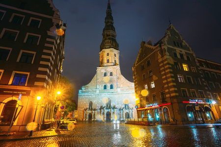 Night View Of St. Peters Church In Old Town Riga Latviaのeditorial素材