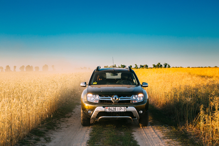 Renault Duster or Dacia Duster SUV in country road through summeのeditorial素材