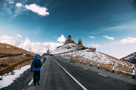 Stepantsminda, Gergeti, Georgia. Man Tourist Backpacker Travelerの写真素材