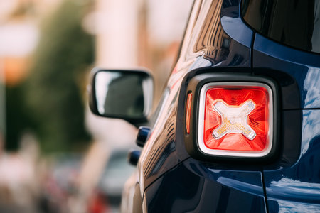 Terracina, Italy. Red Led Rear Lights Of Blue Jeep Renegade Bu 520 Car Parking At Street. Back View