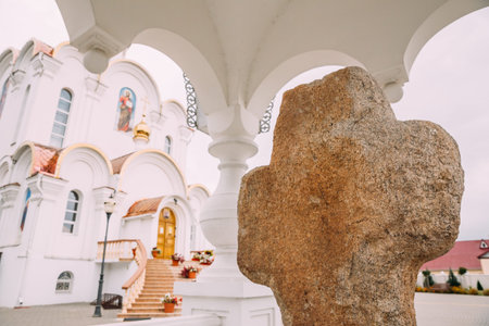 Turov, Belarus. Stone Cross On Background Cathedral Of St. Kirill And Lavrenty Turovskyの写真素材