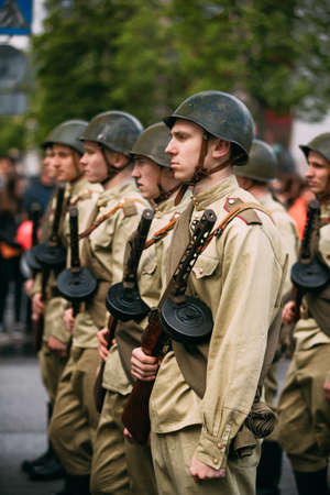 Gomel, Belarus - May 9, 2017: Group Of Re-enactos Dressed As Russian Soviet Red Army Soldiers Of World War Taking Part In Parade During Celebration Of Victory Day 9 May.のeditorial素材