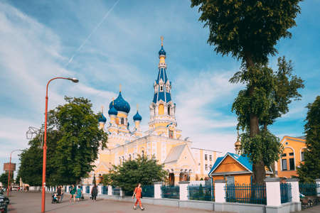 Brest, Belarus - June 6, 2017: People Walking Near St. Nicholas Cathedral In Sunny Summer Day. Famous Landmark Church Of St. Nicholas Or The Fraternal Church.のeditorial素材