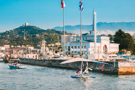Batumi, Adjara, Georgia - September 10, 2017: Motorized Hang Glider Near Marine Station Or Maritime Station Building In Sunny Summer Dayのeditorial素材