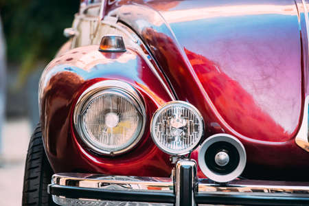 Rome, Italy - October 20, 2018: Close Up Headlight Of Old Retro Vintage Red Color Volkswagen Beetle Car Parked At Streetのeditorial素材