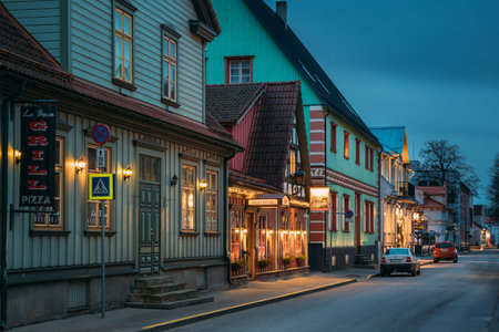Parnu, Estonia. Night View Of Kuninga Street With Old Buildings, Houses, Restaurants, Cafe, Hotels...