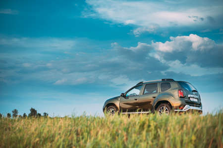 Gomel, Belarus - May 30, 2019: Green Car Renault Duster SUV Parked On Field Country Road.のeditorial素材
