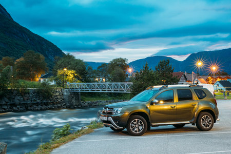 Eidfjord, Norway - June 13, 2019: Car Renault Duster SUV Parked Near Mountains River In Norwegian...