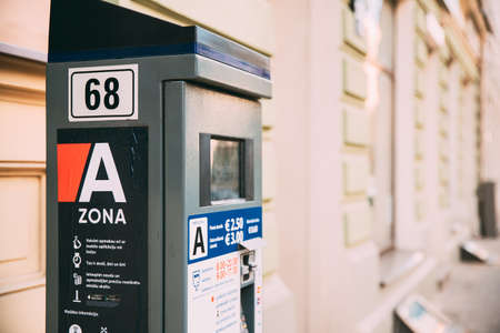 Riga, Latvia - June 9, 2019: Parking Machine Near Parking On Street In Zone A. Machine With Electronic Payment That Issues A Permit To Parking Carのeditorial素材