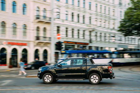 Black Ford Ranger Wildtrak Fast Drive In Summer City Street. The Third-generation Ford Rangerのeditorial素材