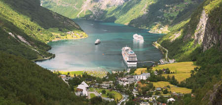 Geirangerfjord, Norway. Aerial View Of Geiranger In Geirangerfjorden In Summer Day. Touristic Ship Ferry Boat Liner Moored Near Geiranger. Famous Norwegian Landmark And Popular Destinationのeditorial素材