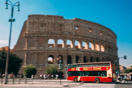 Rome, Italy. Colosseum. Red Hop On Hop Off Touristic Bus For Sightseeing In Street Near Flavian Amphitheatre. Famous World UNESCO Landmark. City Sightseeing Tour.のeditorial素材