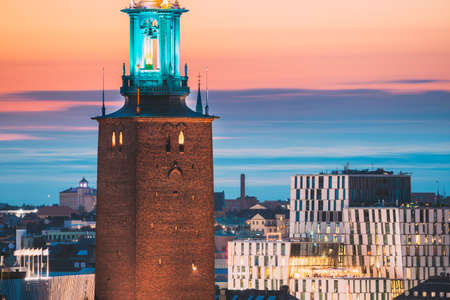 Stockholm, Sweden. Close View Of Famous Tower Of Stockholm City Hall. Popular Destination Scenic In Sunset Twilight Dusk Lights. Evening Lighting.のeditorial素材