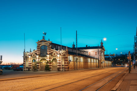 Helsinki, Finland. Old Market Hall Vanha Kauppahalli In City Center In Lighting At Evening Or Night...