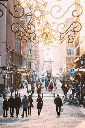 Helsinki, Finland. People Walking On Kluuvikatu Street In Winter Sunny Day. Street Decorated For Christmas And New Year Holidayのeditorial素材