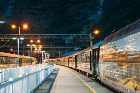 Flam, Norway. Famous Railroad Flamsbahn. Green Norwegian Train Near Railway Stationのeditorial素材