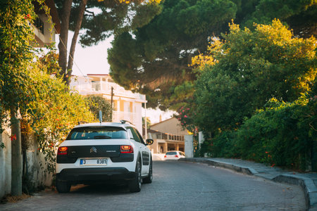 Citroen C4 Cactus Car Parked On Background Of Narrow Town Street. The Citroen C4 Cactus Is A Mini...