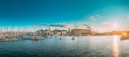 Stockholm, Sweden. Scenic Famous Panoramic View Skyline Of Old Town. Stockholm Cityscape In Sunset Lights. Jetty With Many Moored Yachts During Sailing Regatta. Popular Destination Place.のeditorial素材