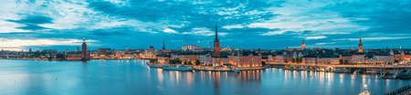 Stockholm, Sweden. Scenic View Of Stockholm Skyline At Summer Evening. Famous Popular Destination Place In Dusk Lights. Riddarholm Church In Night Lighting. Panorama Panoramic View.のeditorial素材