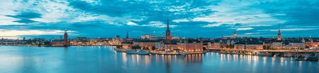 Stockholm, Sweden. Scenic View Of Stockholm Skyline At Summer Evening. Famous Popular Destination Place In Dusk Lights. Riddarholm Church In Night Lighting. Panorama Panoramic Viewの写真素材