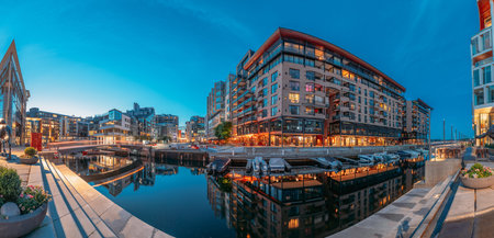 Oslo, Norway. Night Embankment And Residential Multi-storey Houses In Aker Brygge District. Summer...