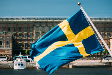 Stockholm, Sweden. Waving Swedish Flag In Stockholm Streetの写真素材
