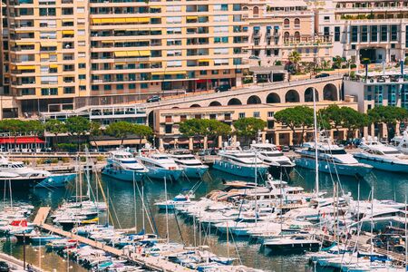 Monaco, Monte Carlo. Yachts Moored Near City Pier, Jetty In Sunny Summer Day.の写真素材