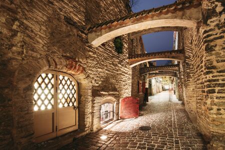 Tallinn, Estonia, Europe. St. Catherines Passage At Winter Evening In Night Illuminations. Narrow Medieval Street. Famous Landmark.の写真素材