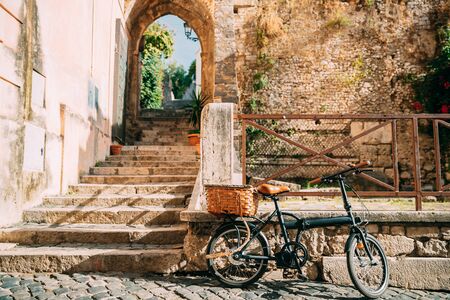 Terracina, Italy. Single Bicycle Bike With Basket Parking On Street Near Old Building.の写真素材