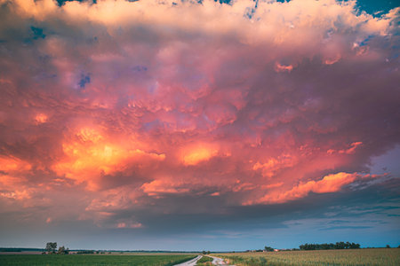 Dramatic Colorful Sky During Approaches Spring Storm Above Landscape With Rural Country Road Through...