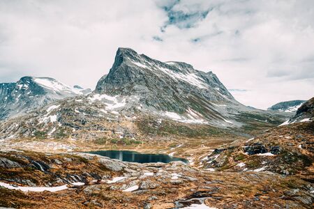 Reinheimen National Park, Norway. Lake Ovstevatnet In Mountains Landscape In Early Summer. Mountain Range In One Of The Largest Wilderness Areas Still Intact In Western Norwayの写真素材