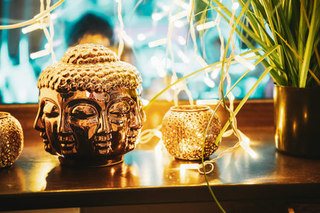 Golden Statue Of Buddha Head Lighted By Bokeh Boke Lights. Interior Element