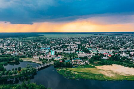 Dobrush, Gomel Region, Belarus. Aerial View Of Dobrush Cityscape Skyline In Spring Sunset Sunrise Time. Residential District And River In Bird's-eye View.の写真素材