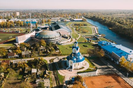 Pinsk, Brest Region Of Belarus, In The Polesia Region. Pinsk Cityscape Skyline In Autumn Morning. Birds-eye View Of Church of the Nativity of the Blessed Virgin Mary And Sports Stadiumの写真素材