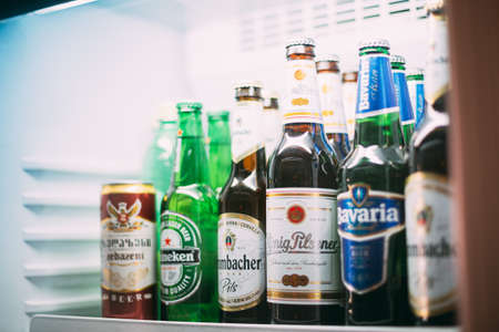 Batumi, Adjara, Georgia - May 25, 2016: Beer bottles at the bar refrigerator Alcohol drinksのeditorial素材