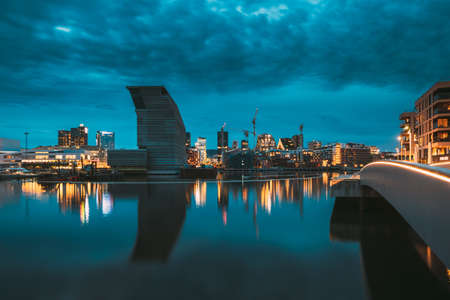 Oslo, Norway - June 24, 2019: Night View Embankment And Residential Multi-storey House In Gamle Oslo District. Summer Evening. Residential Area Reflected In Sea Waters.のeditorial素材