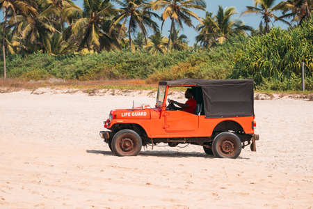 Goa, India - February 10, 2020: Lifeguard By Car On Duty At Beach.のeditorial素材