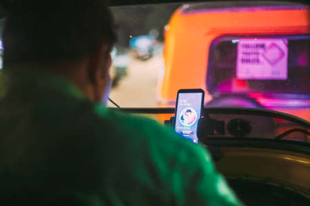Goa, India - February 13, 2020: Driver Of Auto Rickshaw Or Tuk-tuk At Workのeditorial素材