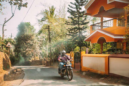 Goa, India - February 14, 2020: People Riding On Scooters Motorcycle On Street.のeditorial素材