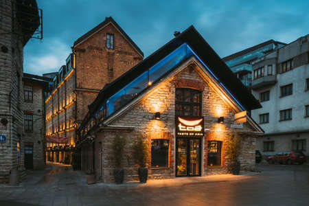 Tallinn, Estonia - December 5, 2016: Cafe In Historical Rotermann City Quarter In Evening Illuminations. Rotermann Quarter Includes Old Industrial Buildings With New Function And Modern Architecture.のeditorial素材