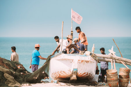Arossim, Goa, India - February 18, 2020: Fishermen Stack Nets On Shore In Boatのeditorial素材