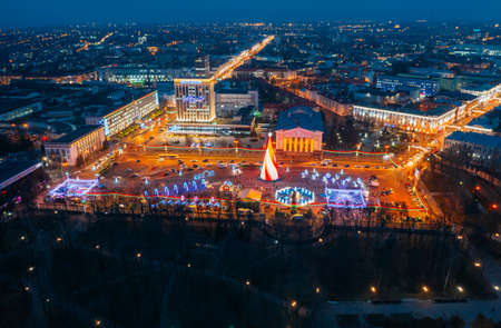 Gomel, Belarus - January 13, 2020: Main Christmas Tree And Festive Illumination On Lenin Square In Homel. New Year In Belarus. Aerial Night View.のeditorial素材