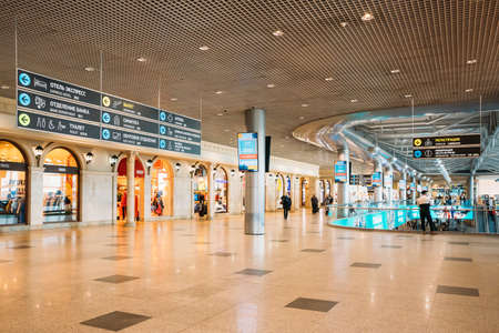 Moscow, Russia - February 22, 2020: People Walking Near Storefront In Waiting Room View Of Domodedovo Airportのeditorial素材