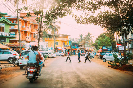 Goa, India - February 13, 2020: People Riding On Scooter Motorcycle On Street.のeditorial素材