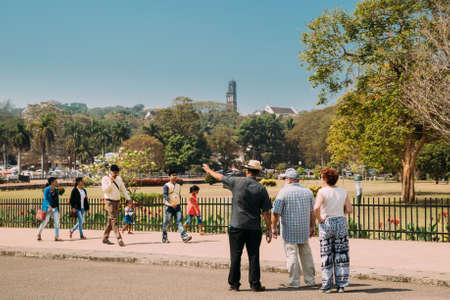 Old Goa, India - February 19, 2020: People Walking Near Se Cathedral. Church Of St. Augustine In Ruined Church Complex On Background.のeditorial素材