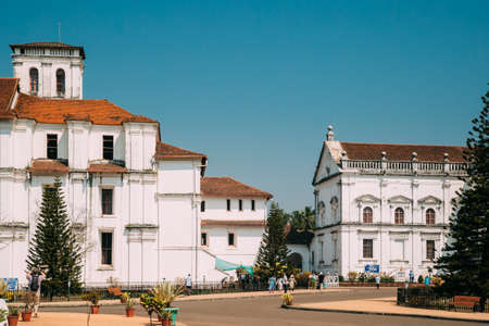 Old Goa, India - February 19, 2020: People Tourists Walking Near Catholic Church Of St. Francis Of Assisi And The S Catedral De Santa Catarina, Known As Se Cathedral.のeditorial素材