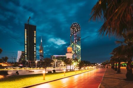 Batumi, Adjara, Georgia. Illuminated Alphabet Tower At Promenade Near Miracle Park, Amusement City Park On Blue Evening Or Night Sky Background. Modern Urban Architecture.の写真素材